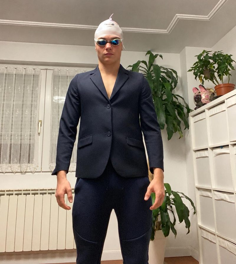 Álvaro in a blazer, swim cap and goggles